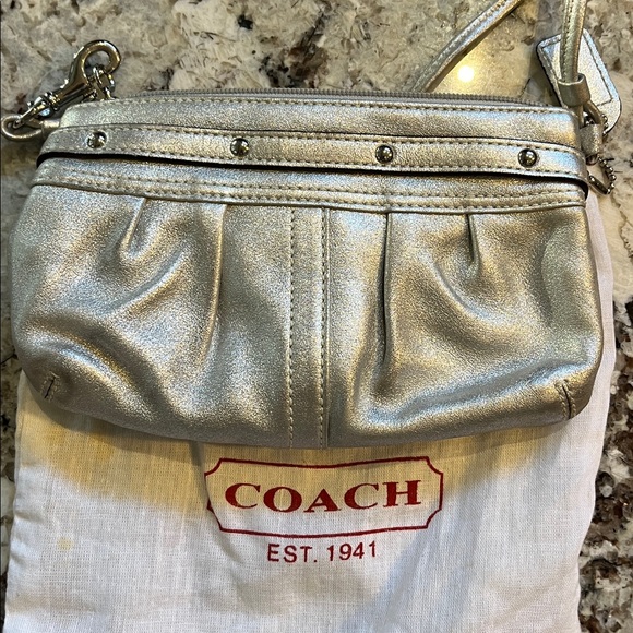 Coach Silver leather wristlet. Pre-Owned Condition-Very Good. - Picture 2 of 9